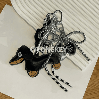 Dachshund şekilli deri açarlik — sumka we sumkaçy üçin bezeg