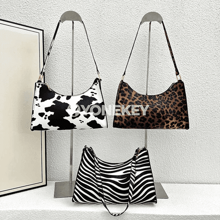 Zenanlar üçin zebra we leopard nagyşly PU deri elde alynýan sumka