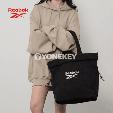 Gyzlar üçin niýetlenen giň we owadan Reebok sumka