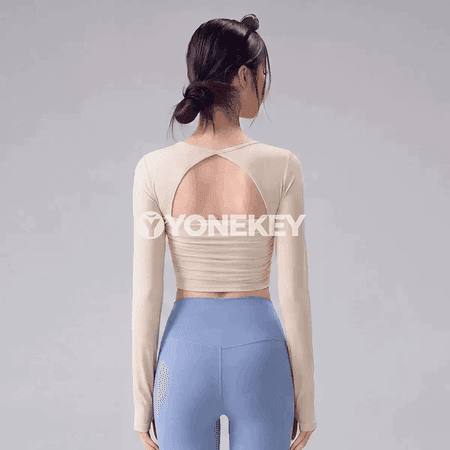 Zenanlar üçin uzyn ýeňli sport köýnegi — ýoga, pilates, ylgaw